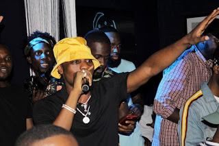 L.AX pictured performing on stage with his fans