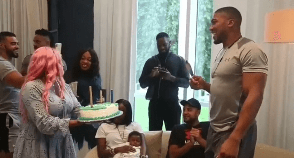 watch as DJ Cuppy welcomes Anthony Joshua With a cake